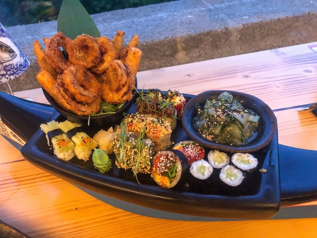 A vegan sushi boat with fried vegetables and seven types of sushi rolls from Subenshi in Porto