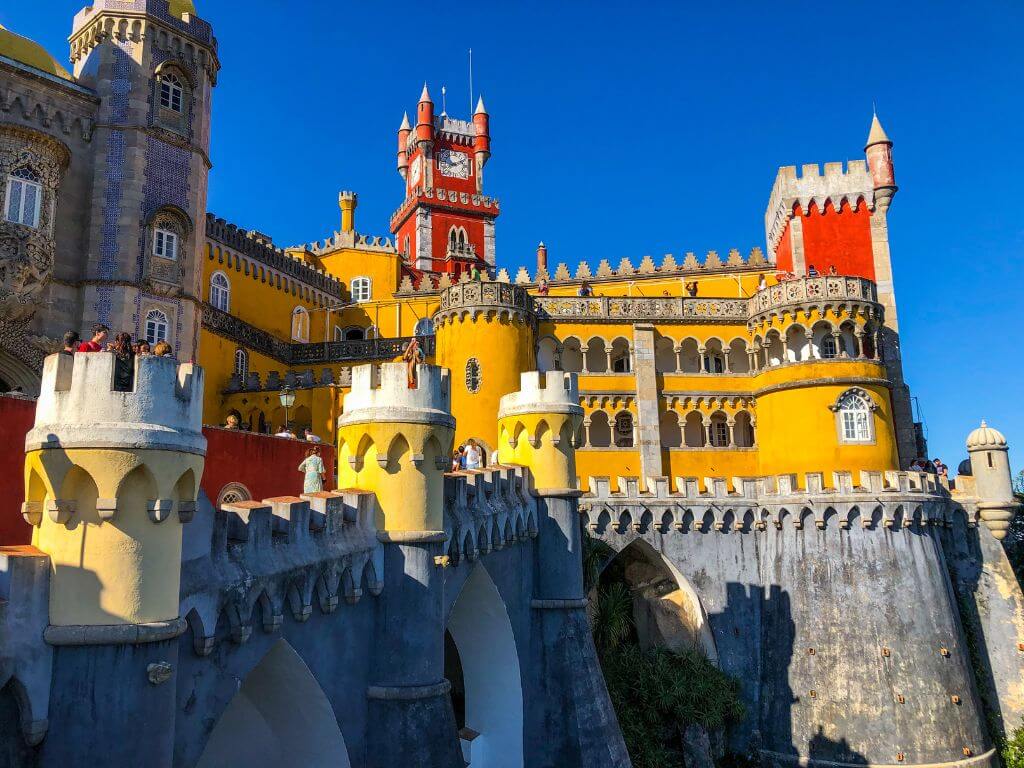 Red, yellow, and blue castle walls at the Palace of Pena in Sintra